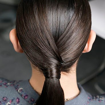 Garnier Fructis - Crisscross Ponytail - sleek ponytails back in big way - try fresh take with shine - keep ponytail in place, fend off frizz with Sleek & Shine Hairspray